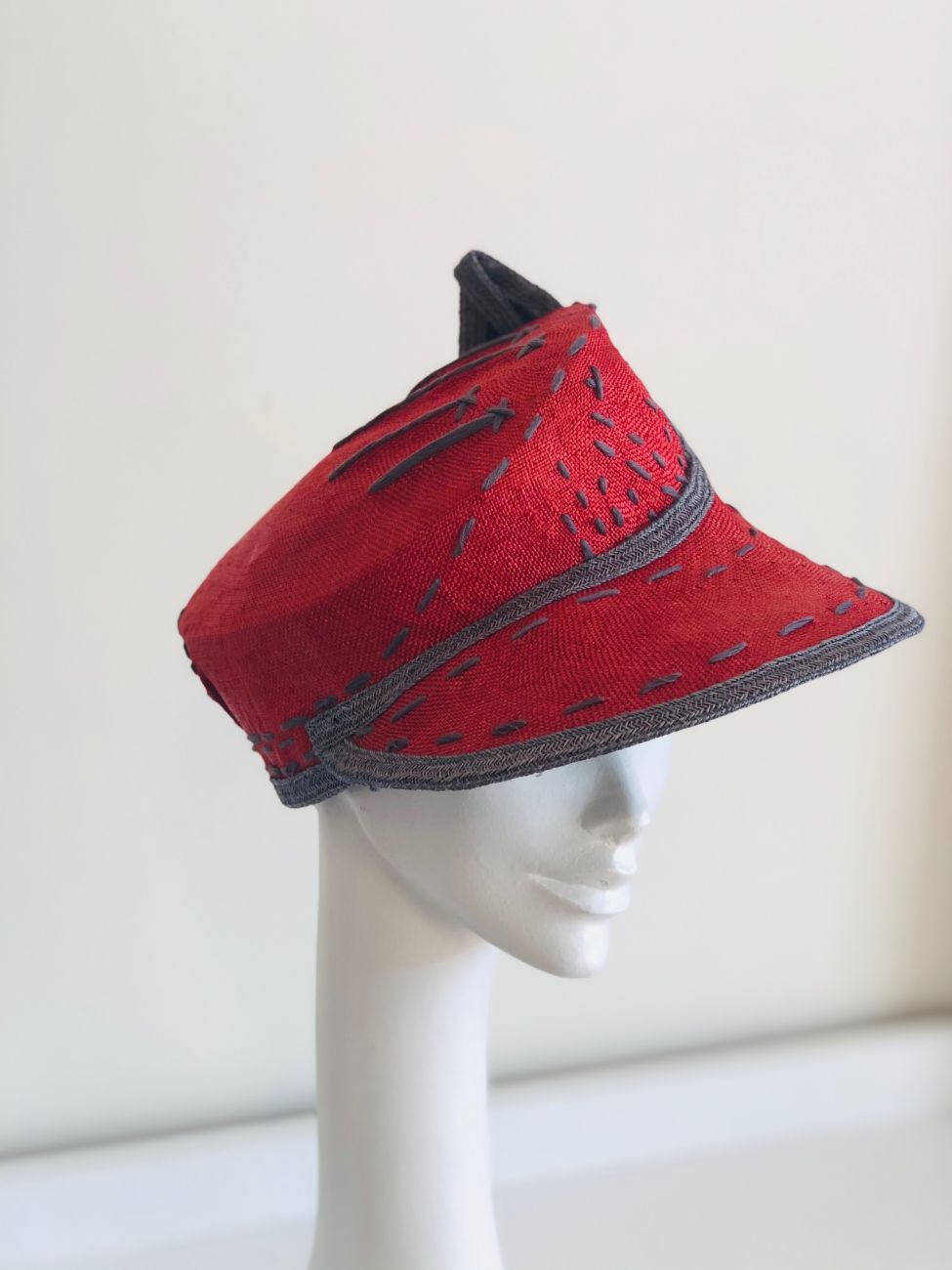 Red straw cap by Waltraud Reiner