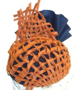 Orange and blue woven headpiece by Waltraud Reiner